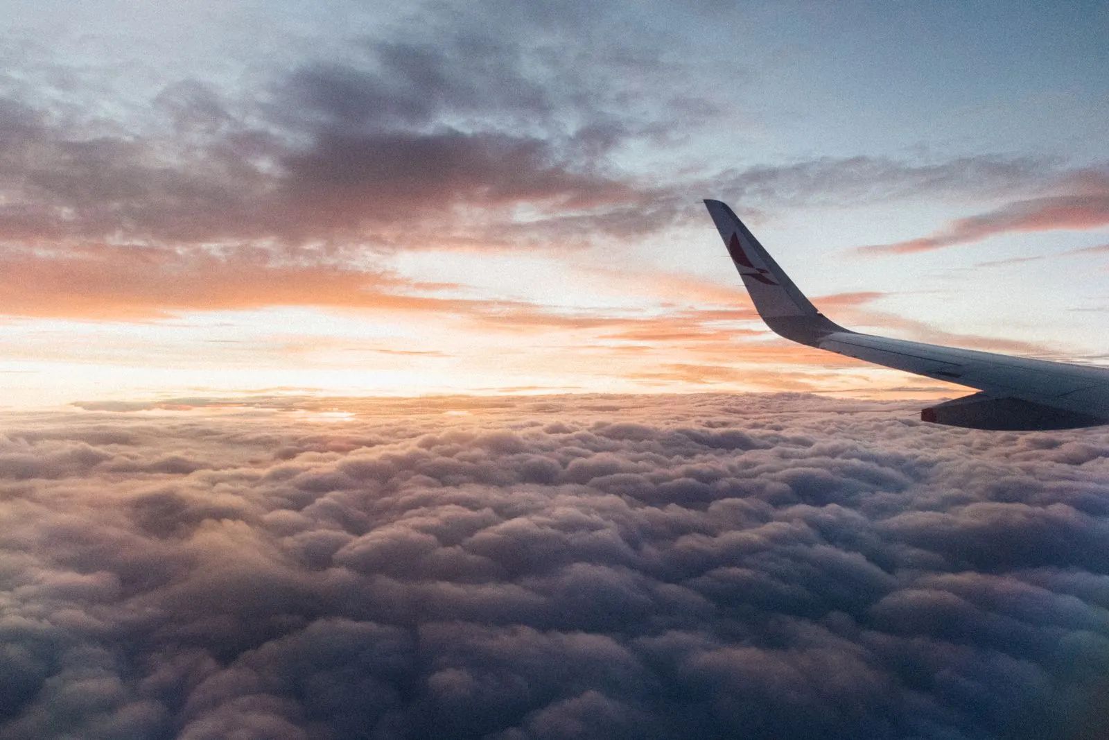 View over an aircraft wing at cruising altitude on a long-haul flight into Dulles